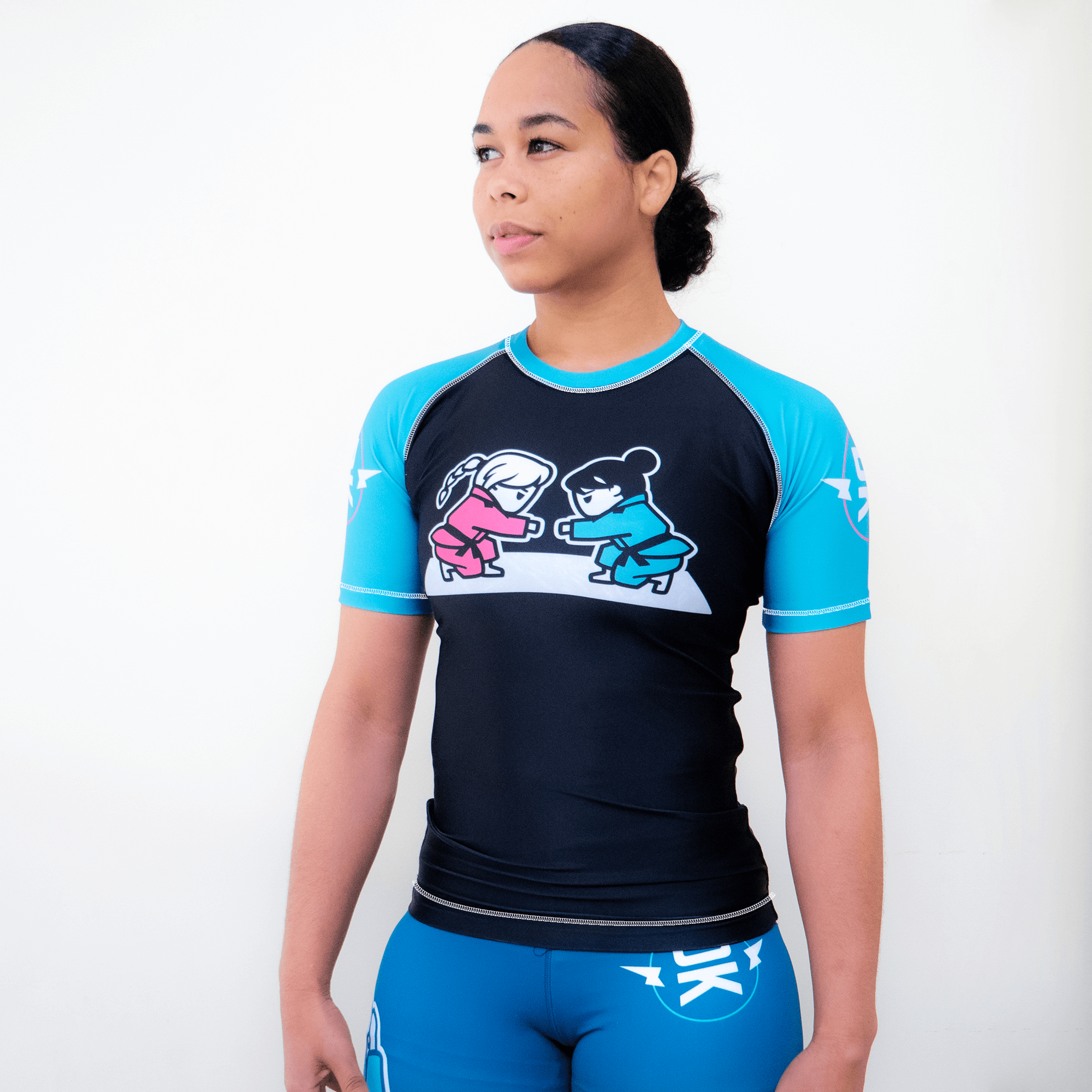 Girls Fist Bump Rashguard - Pink, Teal – Distant Klash Girls Fist Bump Rashguard - Pink, Teal – Distant Klash